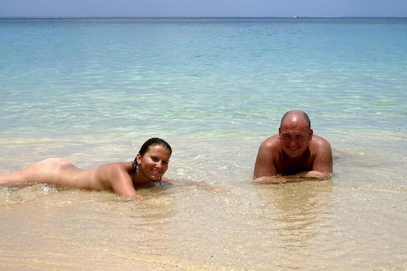 Happy Nudist Couple naked on Holiday Beach