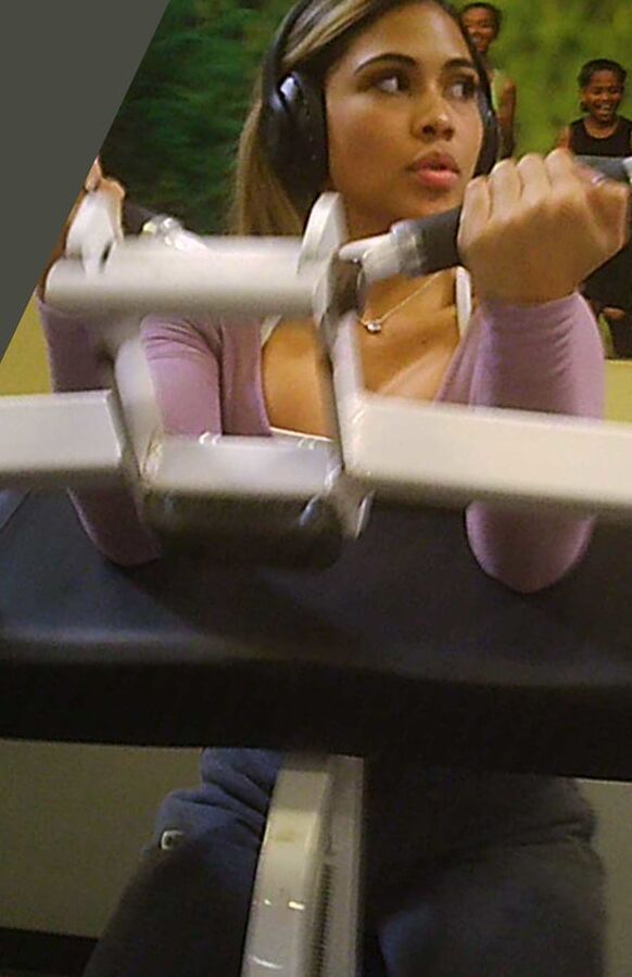 Latina beauty shows massive cleavage in gym