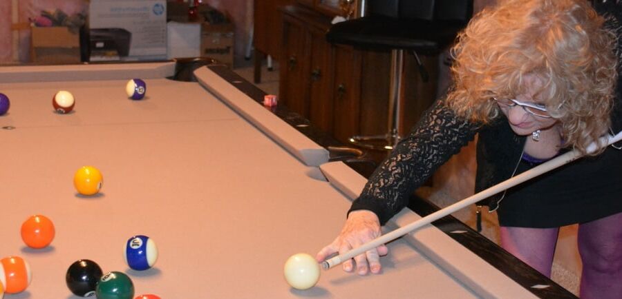 Playing pool in Purple Bustier
