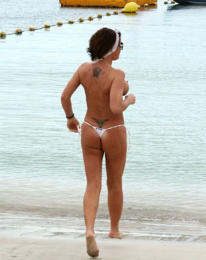 Daniella Westbrook topless Tenerife beach jan