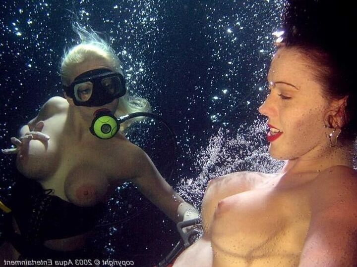Enjoying her underwater tits