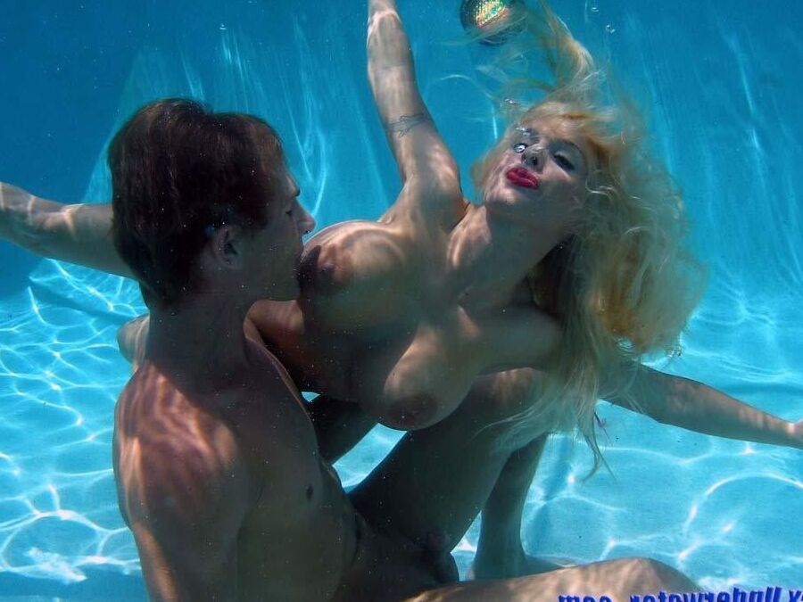 Enjoying her underwater tits