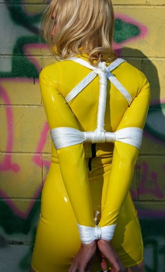 Carrie tied up and gagged in yellow latex