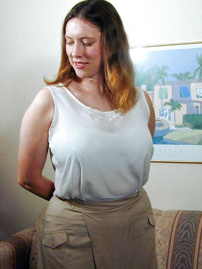 Pale redhead with big tits shows off