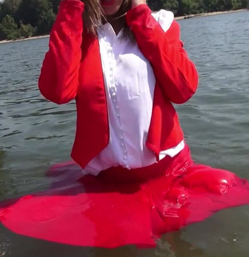 Lady in red goes for a swim fully clothed