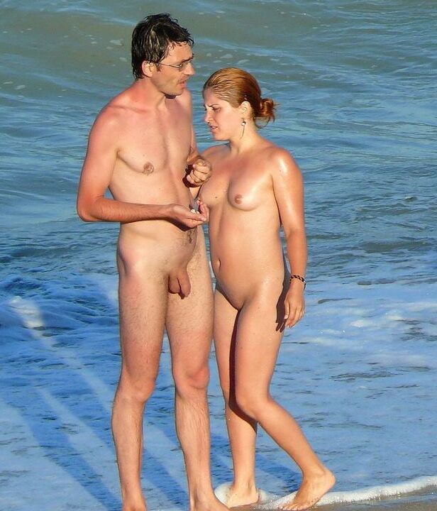 Nude beach couple and caress.