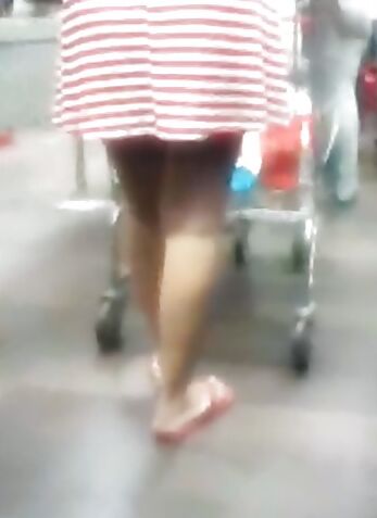 Upskirt lady in shop