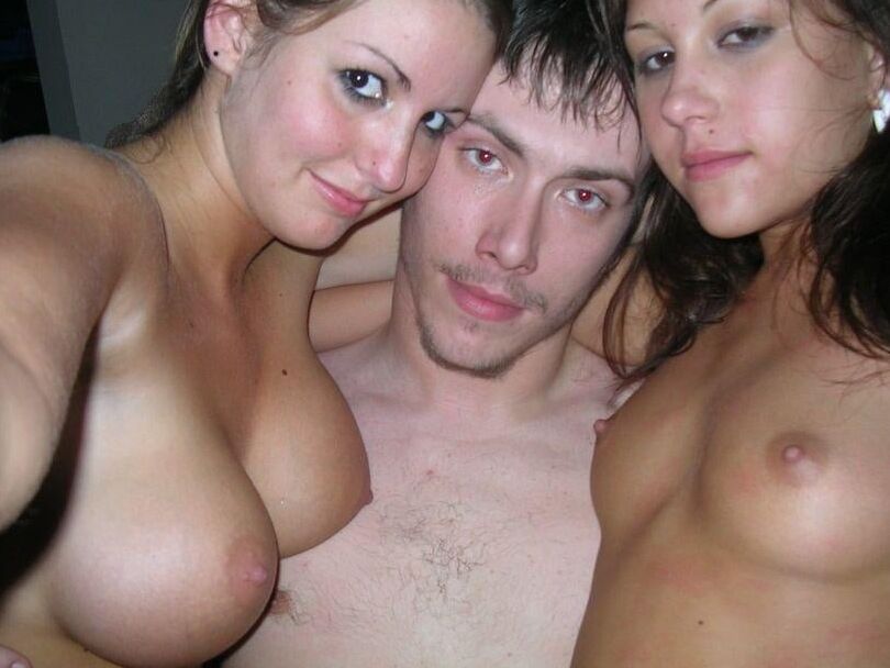 Sexy brunette with big fake tits having threesome