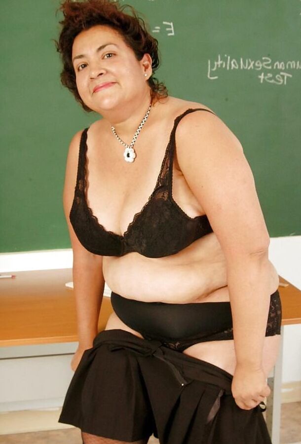 Mature teacher strips down to just her fishnet stockings