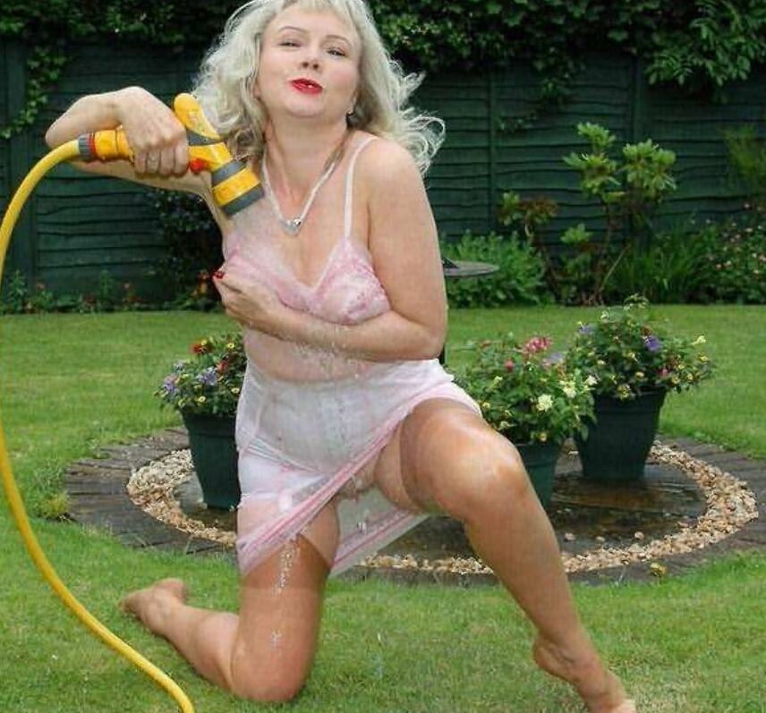 Sue wets her slip in the garden
