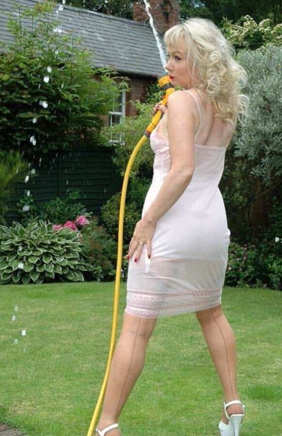Sue wets her slip in the garden