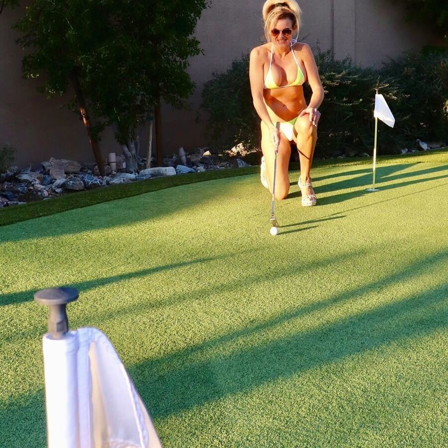 Hot amateur mature mom playing golf and posing