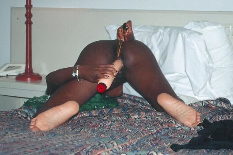Black girl playing with dildos