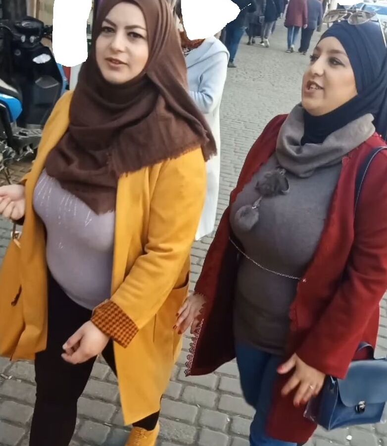 tow arabian hijab girls with huge boobs spy in street