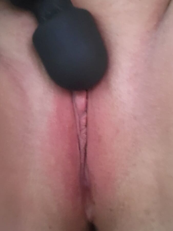 Bored housewife milf playing with vibrator wand toy