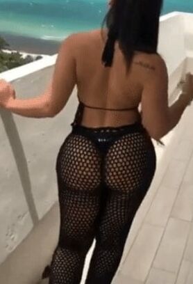 Sexy woman in black thong and mesh pants