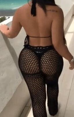 Sexy woman in black thong and mesh pants
