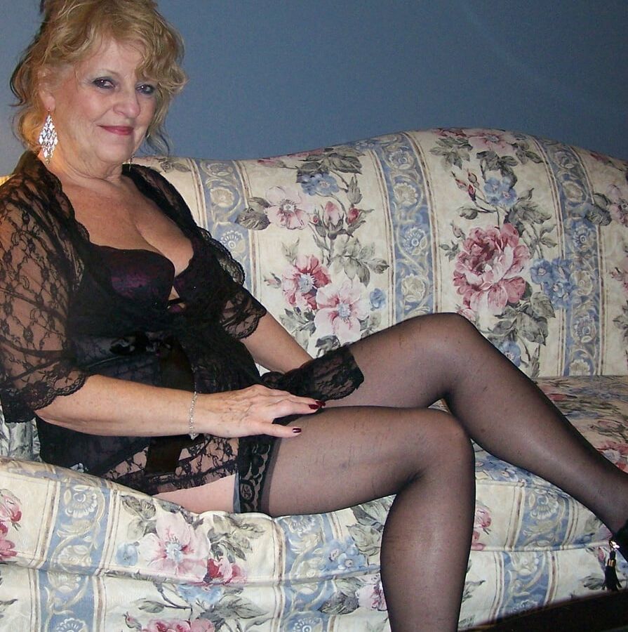 Lounging in lace bustier and nylons