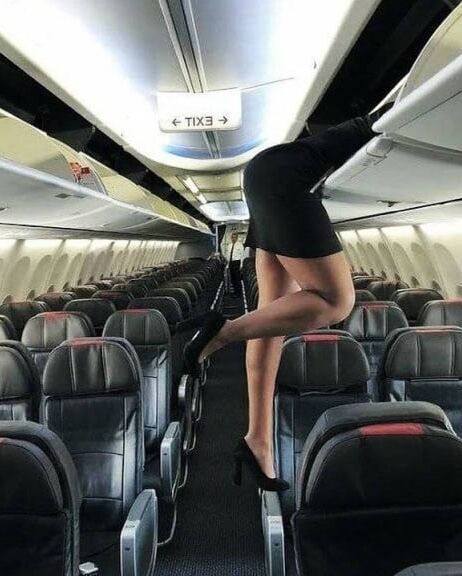 Sexy Stewardess in Heels and stockings