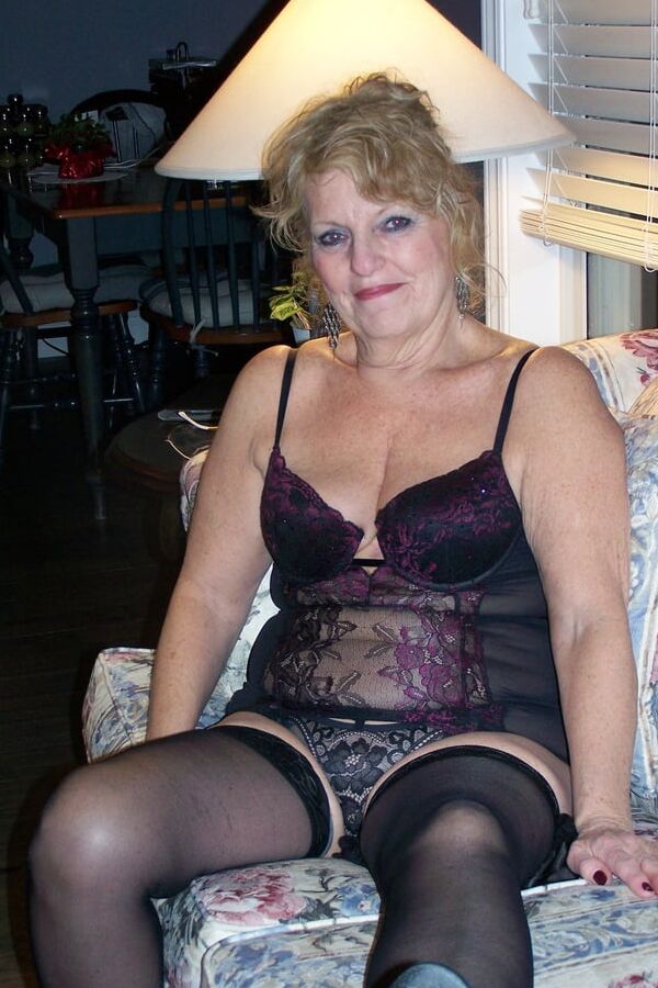 Lounging in lace bustier and nylons