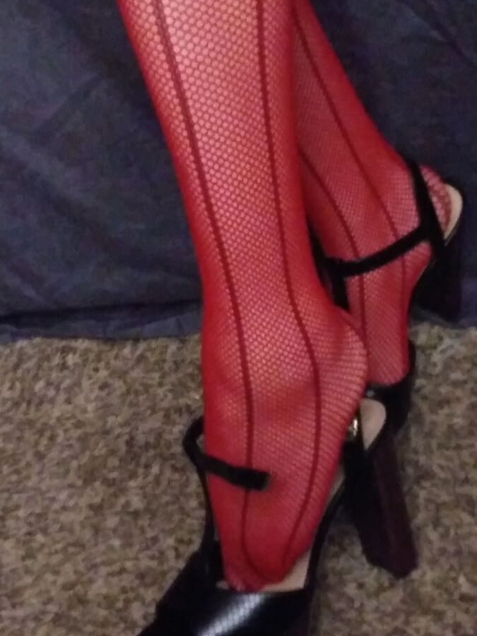 red fishnets and black heels