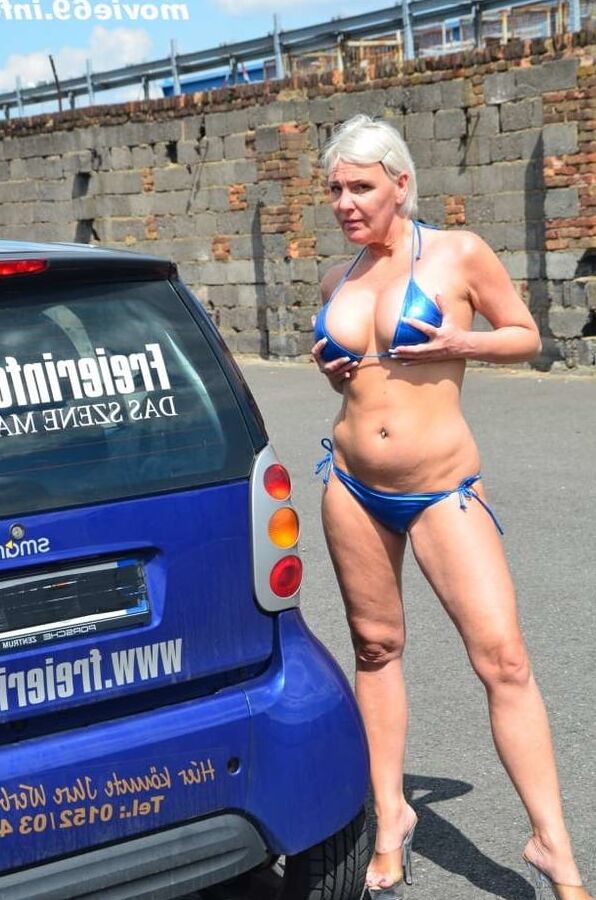 Jill Summer at the carwash in a bikini and topless