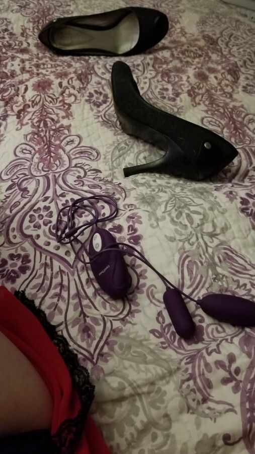 Naughty housewife tease black heels and red lingerie. Milf