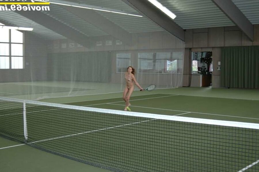 Nathalie plays naked tennis in a tennis hall