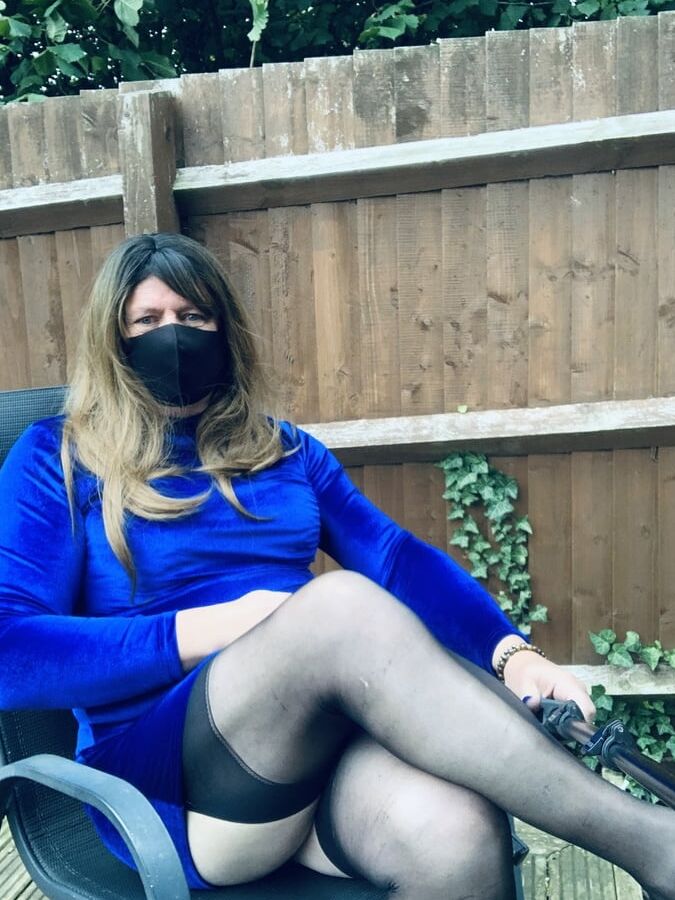 Kelly in blue velvet dress in stockings and heels