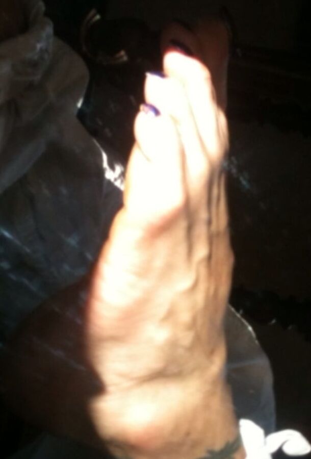 Blue toenails under sun ray