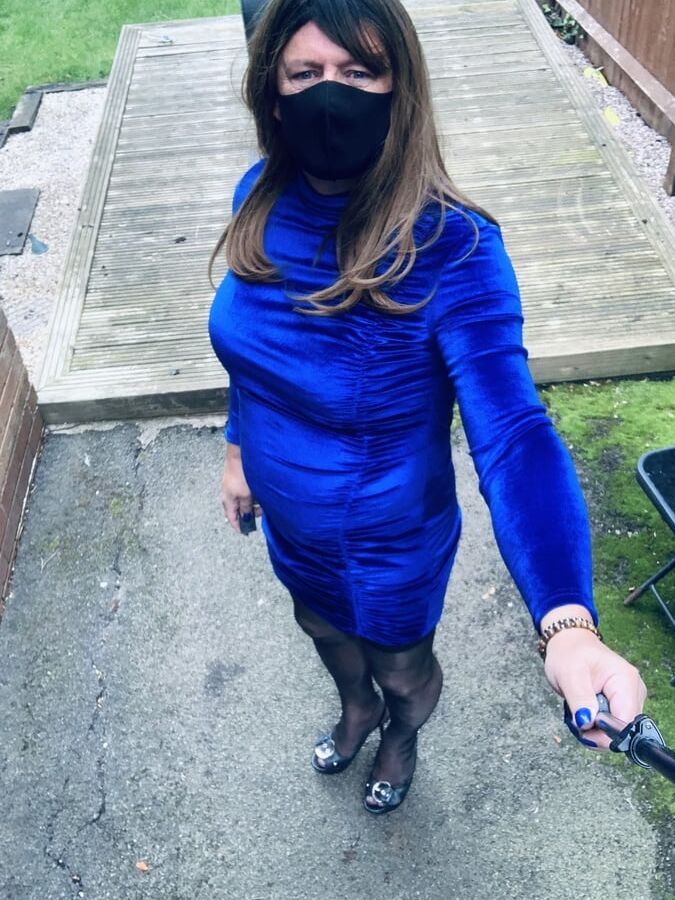 Kelly in blue velvet dress in stockings and heels