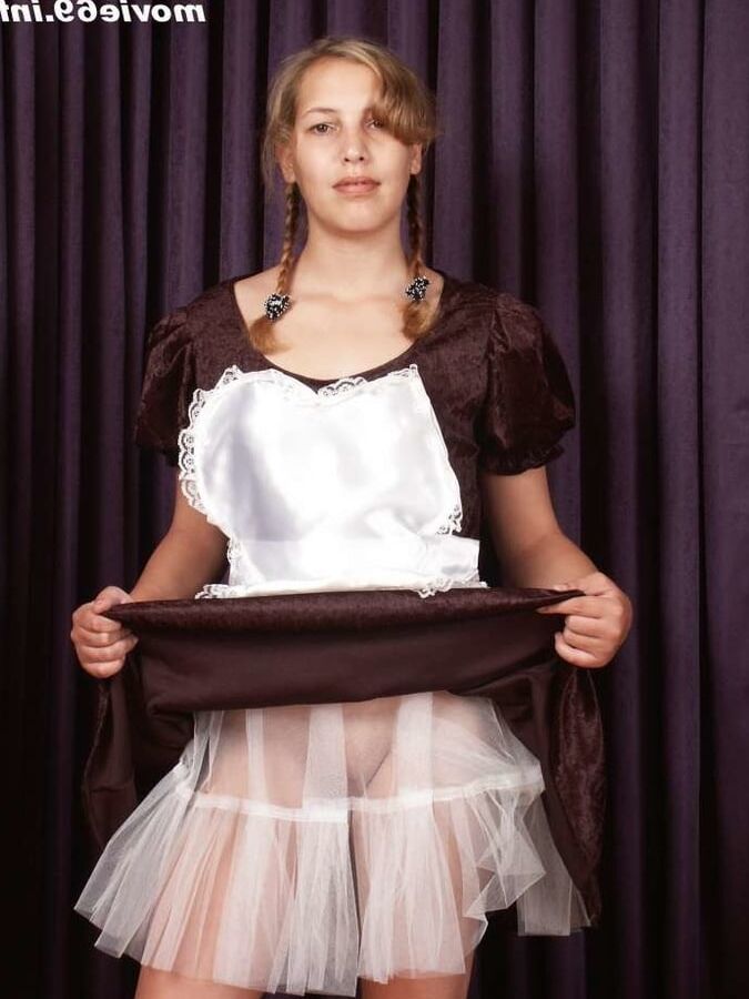 Teen Nathalie poses as a maid and strips
