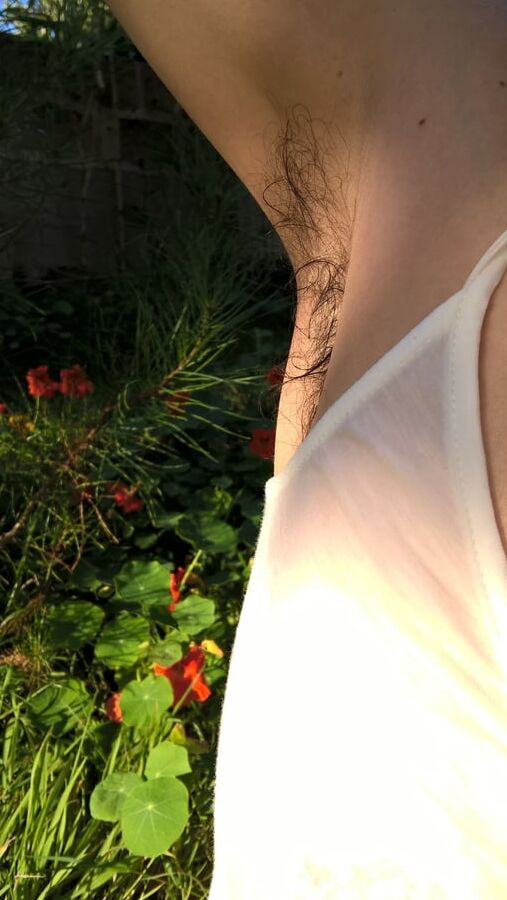 My Beautiful hairy wife in wet t shirt in the garden