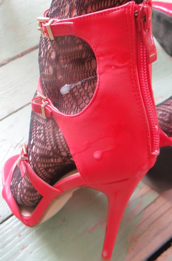 cummed red zipper of her ankle strap heels