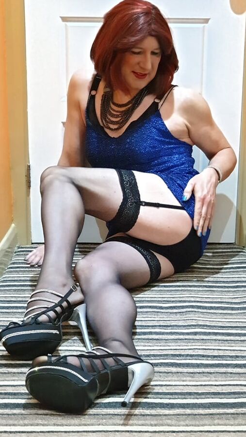 Sissy Lucy showing off in blue dress stockings and chastity