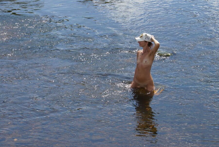Nude in river&;s water