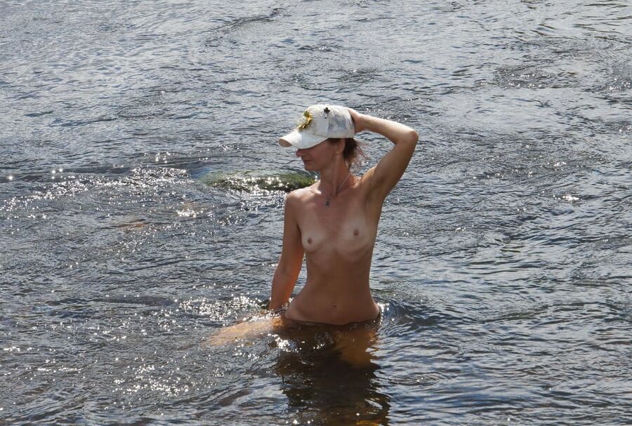 Nude in river&;s water