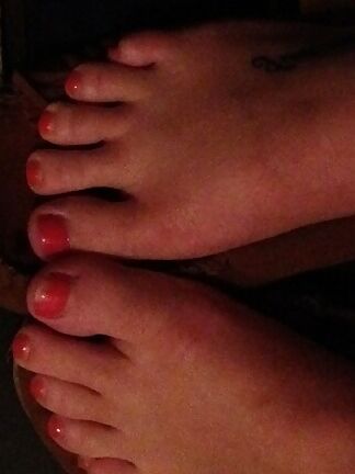 my wifes feet with long red nails