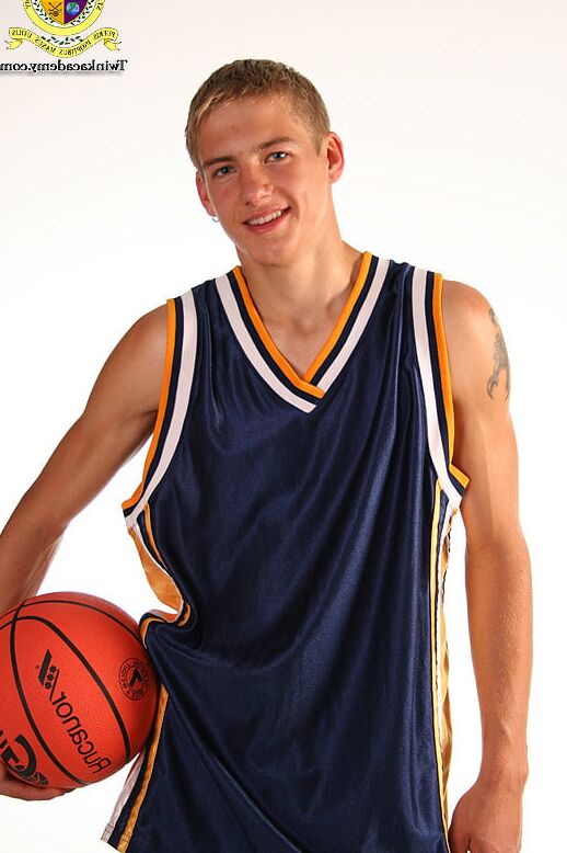 Blond teenage Latvian hunk poses in his basketball uniform
