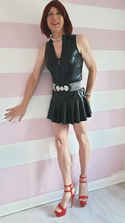 Sissy lucy showing off in wet look skater dress and chastity
