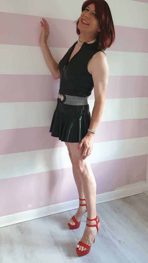 Sissy lucy showing off in wet look skater dress and chastity