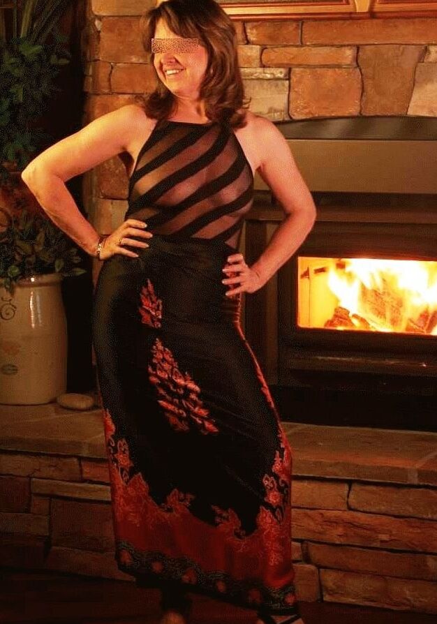 romantic matures in front of fireplace