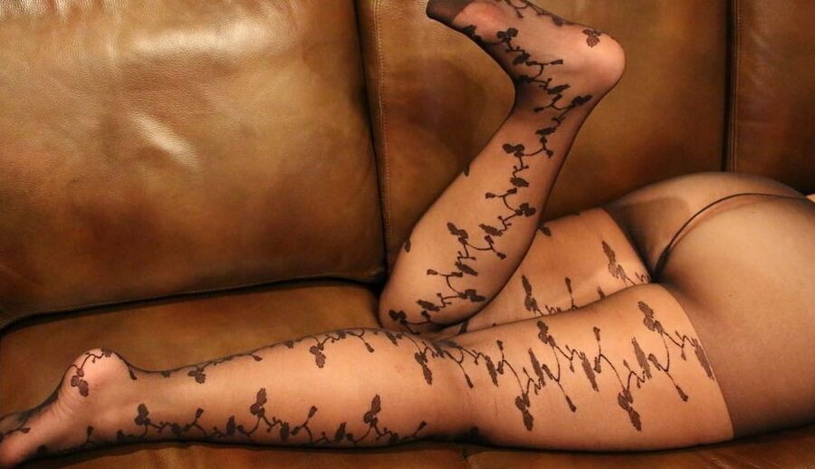 Pantyhose matures on the couch
