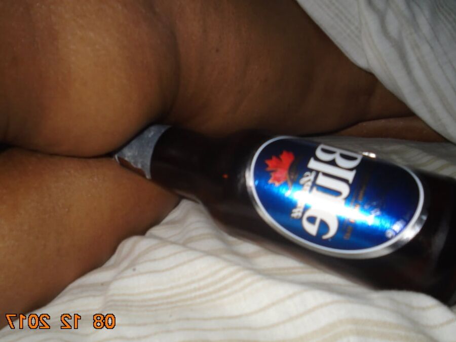 hubby putting bottles in ass and pussy
