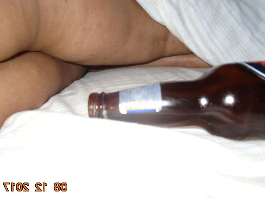 hubby putting bottles in ass and pussy