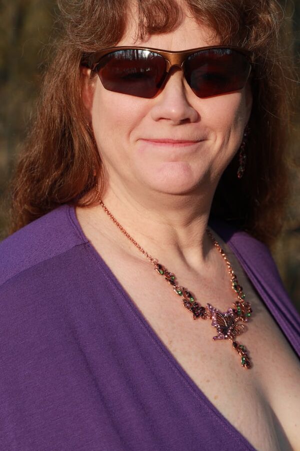 Sally in Purple dress flashing outside
