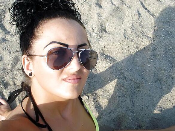 Amateur brunette wife in transparent bikini on the beach
