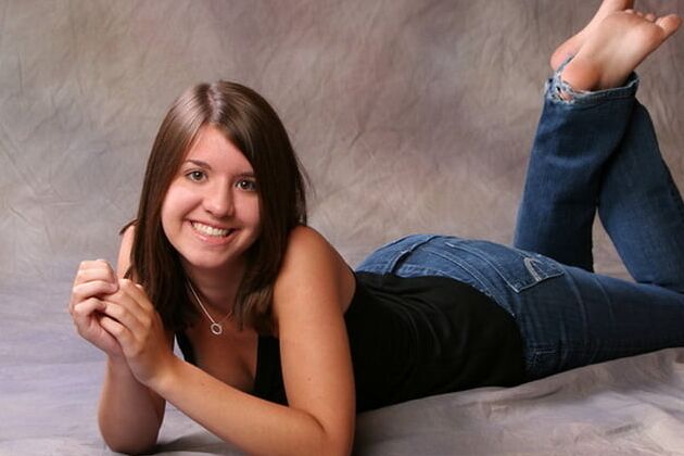 Sexy feet in prone position. Belly down feet up.