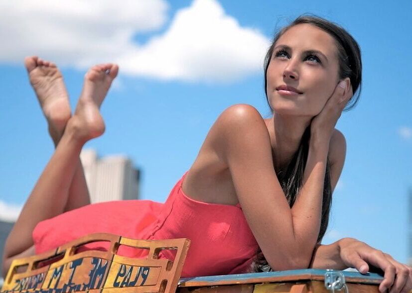 Sexy feet in prone position. Belly down feet up.