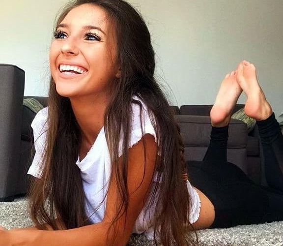 Sexy feet in prone position. Belly down feet up.